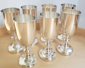Seven Silver Plated Mid Century 1950s WMA Rogers shot glasses. Lot vintage Cocktail Glasses.  Mid century silver barware. Vintage silver lot