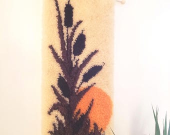 Vintage 1970's rug hooked wall hanging. 1970's sunset and bullrushes bohemian cozy decor. Vintage authentic boho latch hook wall hanging.