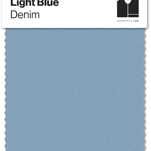 May include: A light blue denim fabric swatch with the text "Light Blue Denim" in black. The swatch has a textured appearance and a jagged edge. The Garments Lab logo is in the upper right corner.