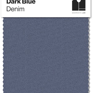 May include: A swatch of dark blue denim fabric with a diagonal weave pattern. The text "Dark Blue Denim" is printed in black on a white label above the fabric. The label also includes a black logo and the text "GARMENTS LAB".
