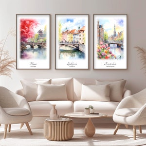 a living room with three paintings on the wall