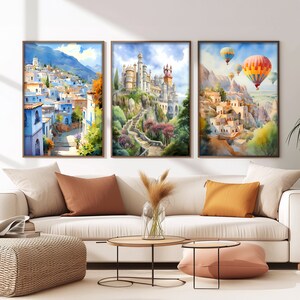 a living room with a couch and paintings on the wall