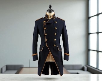 May include: A navy blue military-style coat with gold trim and buttons. The double-breasted coat features a high collar and epaulets. The coat is displayed on a mannequin against a neutral background, showcasing its tailored design and formal aesthetic.