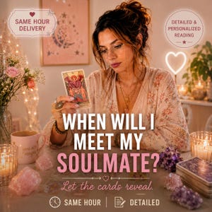 May include: A tarot card reading setup featuring a person holding The Lovers tarot card. The scene includes a pink mug with the text you are magic, various raw crystals, a deck of tarot cards, and text reading WHEN WILL I MEET MY SOULMATE?