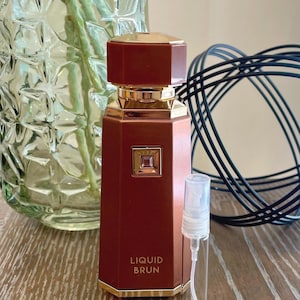 May include: A set of three ceramic mugs with a speckled, matte finish. The mugs are in shades of cream, light gray, and dark gray. Each mug has a simple, minimalist design, perfect for coffee or tea.