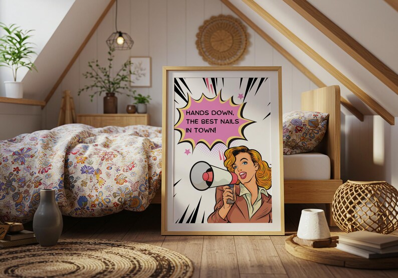 Retro style wall art featuring a woman with a megaphone displayed in a cozy room. "Hands Down" pun typography print for nail technicians. Fun and colorful comic book aesthetic poster for beauty room interior design.