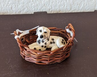 Dalmatian dog Laying in Basket figurines