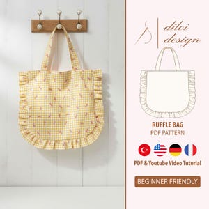May include: A yellow gingham tote bag with a ruffle trim, hanging on a wooden rack. The bag has a light pink interior and a pattern of small pink bows. The image also includes a line drawing of the bag and text that says "RUFFLE BAG PDF PATTERN".