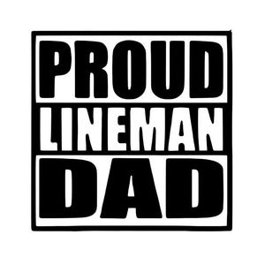 May include: Black and white graphic design with the words "PROUD LINEMAN DAD" in a bold, blocky font. The text is arranged in three horizontal lines within a black rectangular border.