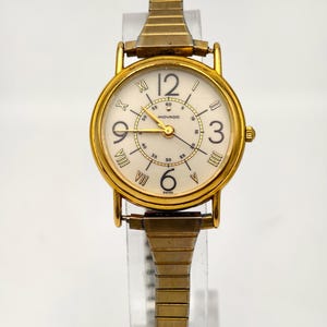 Vintage Movado Ladies Gold Tone Quartz Watch Roman Arabic Dial 1990s