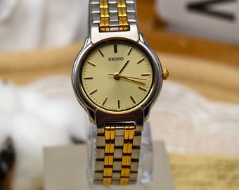 Vintage Seiko Quartz Japan 2E20 Base Metal St. Steel Back 2E20