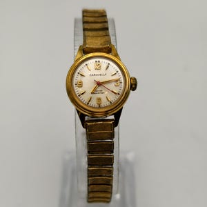 Vintage caravelle by bulova 1978 ladies mechanical watch,20.8mm case,stretch band