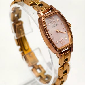 Vintage Seiko Ladies Rose Gold Tone Quartz Watch Pink Dial Roman Numerals