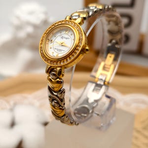 Orologio da donna al quarzo Wrangler vintage anni '90 con lunetta in cristallo color oro e bracciale a forma di cuore