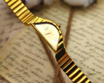 Vintage 1980s Seiko Rivoli Gold Tone Half Moon Dainty Elegant