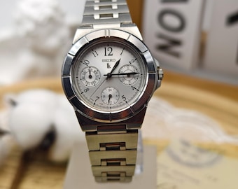 Vintage Seiko damklocka i rostfritt stål med kvartsurtavlor
