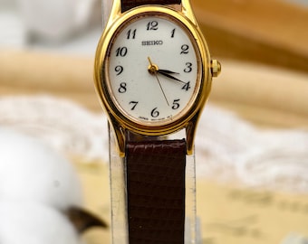 Vintage 1990s Seiko Ladies Quartz Watch Gold Tone Oval Case Brown Strap