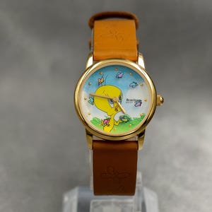 Reloj de cuarzo chapado en oro para dama Armitron vintage de 1997 con esfera de Tweety Bird