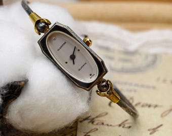 Reloj de pulsera Gladstone para mujer, estilo vintage de los años 80, de cuarzo, con caja ovalada y brazalete. Fabricación suiza.