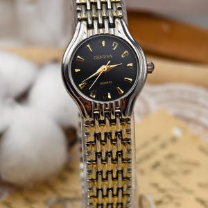 Vintage Geneva Ladies Quartz Two Tone Black Dial Watch 23mm