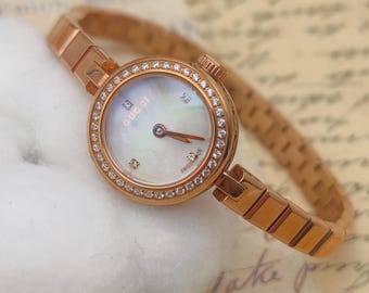Vintage 1990s Gucci Gold Tone Watch: Mother of Pearl Dial, Crystal Bezel