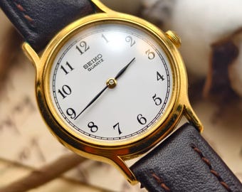 Vintage 1990s Seiko Ladies Watch: Gold Tone Case, Brown Leather Strap