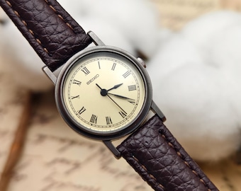 Vintage Seiko Ladies Quartz Watch Gunmetal Case Roman Numeral Dial Brown Leather Strap