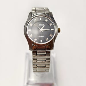 Vintage caravelle by bulova women&#39;s stainless steel black dial watch, diamond markers,runs