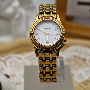 Vintage 1990s Accutron Ladies Gold Tone Quartz Watch with Date