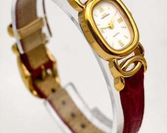 Vintage 1990s Technos Ladies Gold Tone Quartz Watch 18mm Roman Dial Red Leather Strap