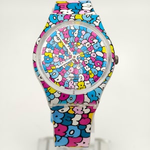 Reloj Swatch unisex de cuarzo de plástico 2010 «Doreeboy» con esfera gráfica de 33,6 mm