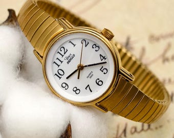 Vintage 2000s Timex Ladies Quartz Watch Gold Tone Expansion Band White Dial Black Numerals
