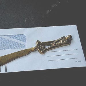 1930 vintage solid brass, collectible. one- of-a- kind  letter opening with a 3d figure  golfer for the handle.