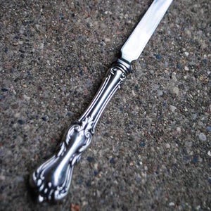 1960 vintage , elegant  letter  opener  with sterling silver  handle,  stainless steel blade in Francis I pattern. By Reed  and Barton .