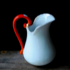 1860 vintage  , americana , extremely rare white porcelain pitcher/creamer /vase with unusual  orange  handle. By JV& Co, #858.