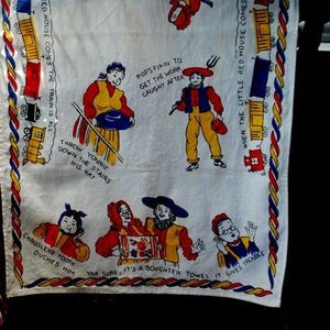 1950 vintage, cotton, collectible  tea towel with bright color  of  Pennsylvania, Dutch, Amish    various  figures and  sayings.