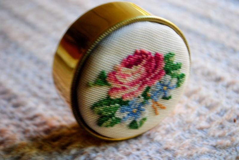 1950 vintage,petit,round, sweet pillbox/ trinket box, gold tone metal base, removable top with cross stitch pink rose, blue flowers