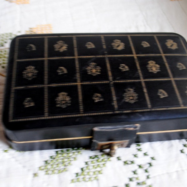 1960  vintage   black  faux  leather,  mod style , sturdy   men's  jewelry box  with cranberry red velvet interior. Made  by Shields.