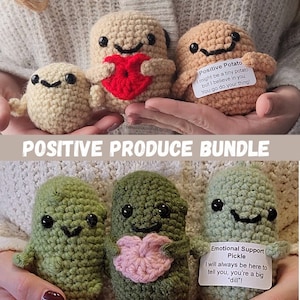 May include: A set of four crocheted plushies, two brown potato-shaped plushies and two green pickle-shaped plushies. Each plush has a smiling face and is holding a heart. The potato plushies have the text "Positive Potato I might be a tiny potato but I believe in you. You go do your thing!" and the pickle plushies have the text "Emotional Support Pickle I will always be here to tell you, you're a big "dill"!"
