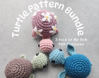 May include: Three crocheted turtle amigurumi patterns. The turtles are pink, green, and blue. The pink turtle has white flowers on its shell. The text "Turtle Pattern Bundle" and "3 Pack of No Sew PDF Patterns" is visible in the image.