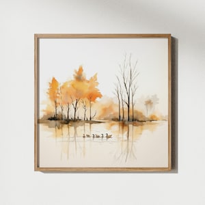 Pode incluir: Uma pintura em aquarela que retrata uma cena de lago com árvores em cores outonais e uma linha de patos nadando na água.