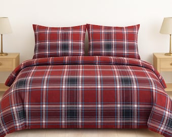 May include: A red, black, and white plaid bedding set. The set includes a duvet cover and two pillowcases. The bedding is displayed on a bed with two matching nightstands and lamps.