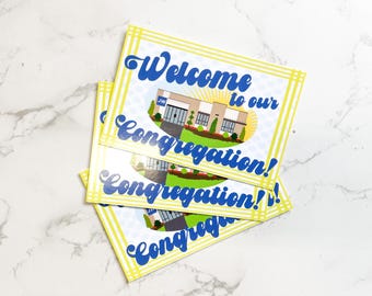 May include: Welcome to our Congregation! A stack of four yellow and blue welcome cards with a cartoon image of a building with a sign that says "JW".