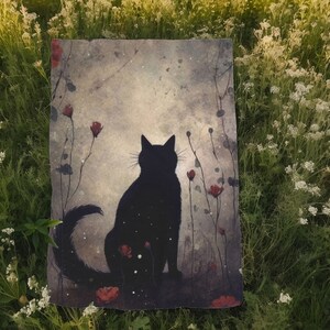 May include: A black cat silhouette with a long tail sits in a field of red flowers. The background is a soft, faded watercolor wash of gray and blue.