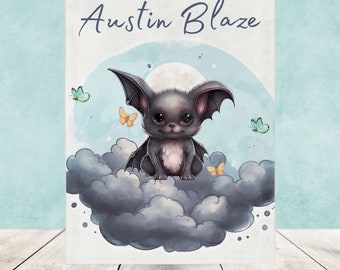 May include: A rectangular print featuring a dark gray bat with large eyes sitting on a cluster of dark gray clouds against a light blue background. The text Austin Blaze is printed in dark blue script at the top, with small yellow and green butterflies.