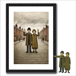 May include: A framed print depicts a couple waving on a cobblestone street lined with brick buildings. The couple wears long brown coats and hats. The artwork has a vintage, storybook style with a muted color palette.