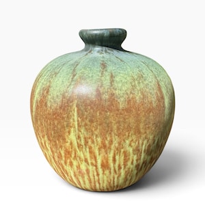May include: A round ceramic vase with a narrow neck and a wide, bulbous body. The surface features a blended glaze with vertical streaks of earthy brown and muted sage green, creating a textured appearance that transitions to a darker green rim.