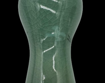 May include: A green ceramic bottle stopper with a crackled glaze finish.