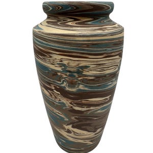 May include: A decorative vase with a marbled effect. The vase has a colour palette of brown, cream, and teal blue, with a swirling pattern. It has a wide base, tapering upwards to a narrower neck and a flared rim. The vase is suitable for home decor and measures approximately 30 cm in height.