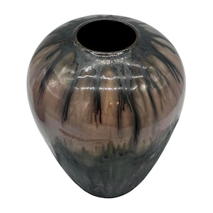 May include: A set of three ceramic nesting bowls in shades of blue, green, and white. The bowls feature a speckled glaze and a simple, modern design. The largest bowl is approximately 6 inches in diameter.